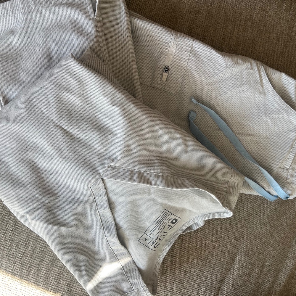 FIGS Women's Scrub Top and Pants Set in Light Gray with Blue Drawstrings